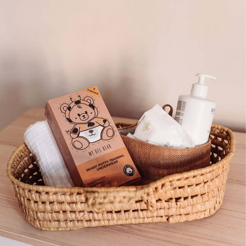 Basket with pack of training underwear and baby creams