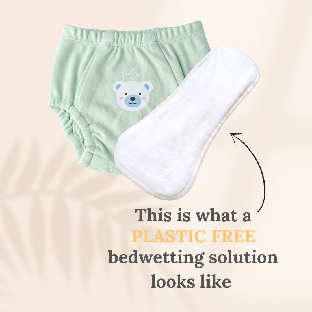 Green training underwear with bear design and white insert on beige background, promoting a plastic-free bedwetting solution.