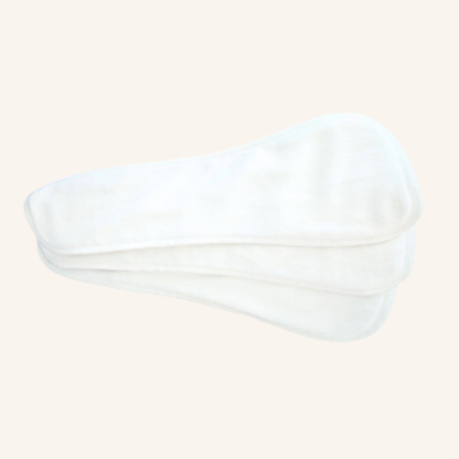 Reusable Booster Pads on a beige background 