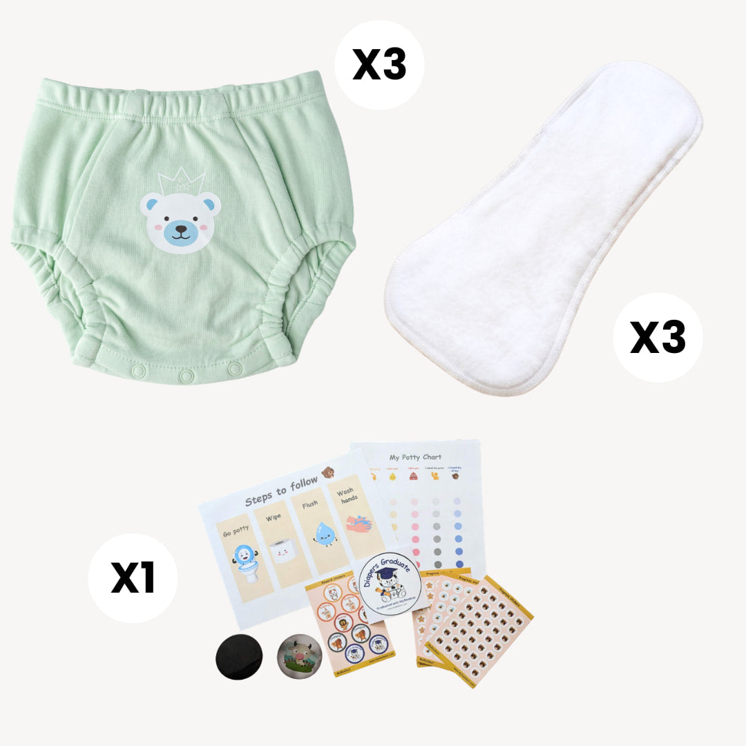 Set of baby products including green training underwear with a bear design, white absorbent pad, and potty training chart with stickers on a white background.